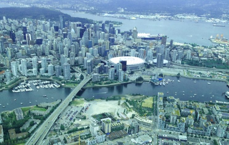 Aerial view of the Olympic Village site and downtown core shows the barren site of the long-promised Olympic Village elementary school. 